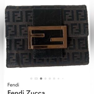 SOLD.  Fendi Zucca Trifold Wallet
With strap to convert to Wallet on chain